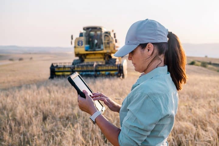 Farmer holding a digital tablet in a field